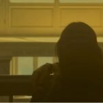woman looking out window at golden hour, poem on love about moving on as a love poem expressed