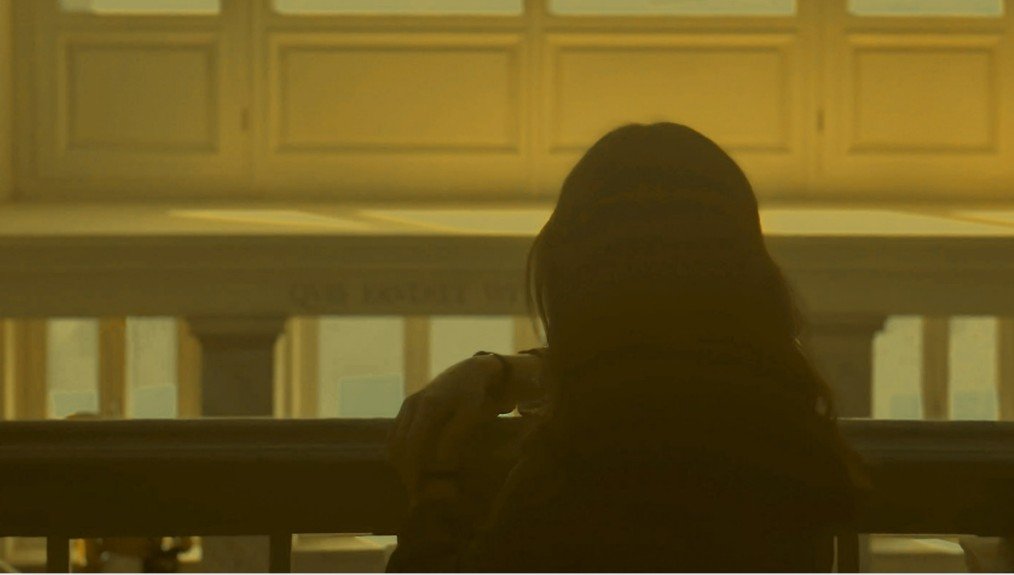 woman looking out window at golden hour, poem on love about moving on as a love poem expressed