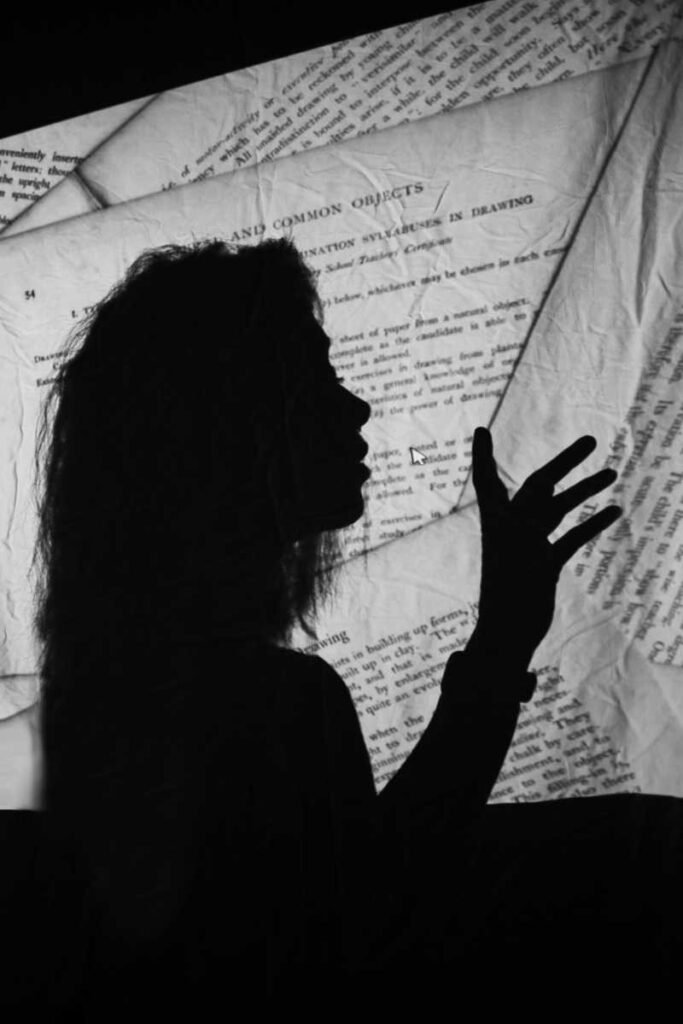 poems about hope, silhouette reaching through shadow and words