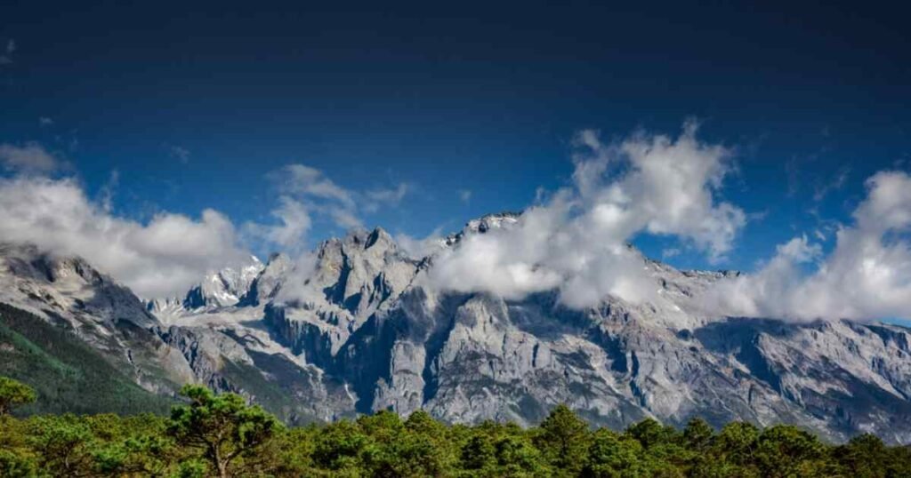 Poem inspired by The Untamed, lone figure in white robes on a misty mountain path