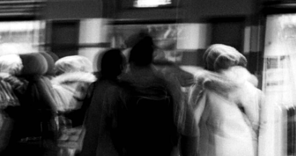 Blurred crowd on a train platform, a poem about someone you met once